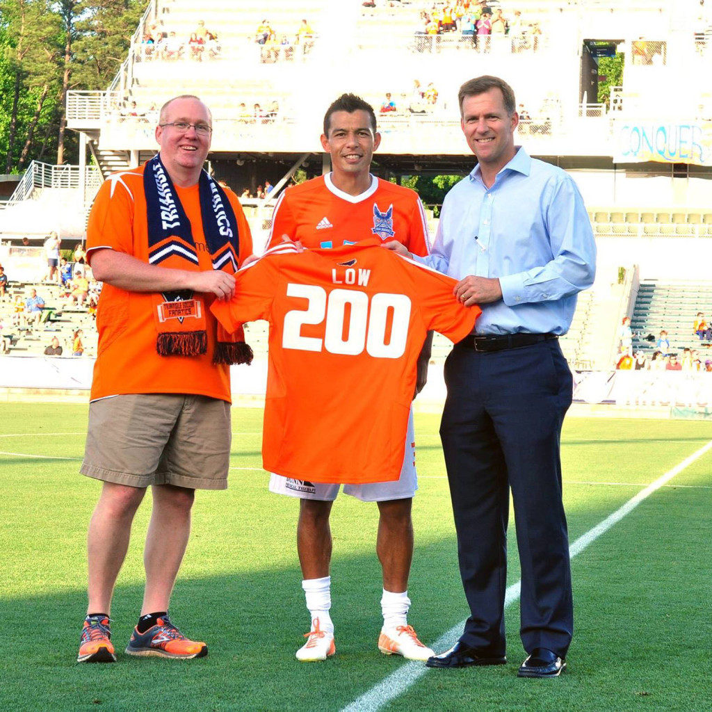 Kupono Low is presented with a commemorative jersey for his 200th game with Carolina (Photo: Carolina Railhawks)