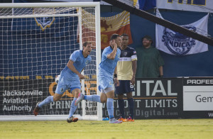 Aaron Pitchkolan and Christian Ramirez celebrate after the latter put in a goal. (Photo: Jacksonville Armada FC)