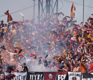 DCFC supporters cheering on their team